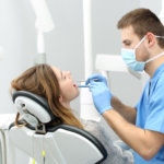 dentist examining patient's teeth