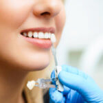 Forest Hills Dentistry discusses the differences between implants and dentures.