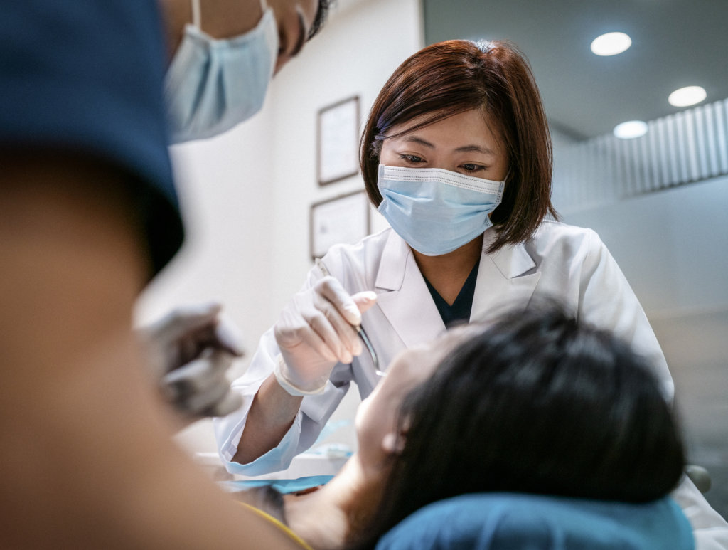 Dentist performing a procedure on patient
