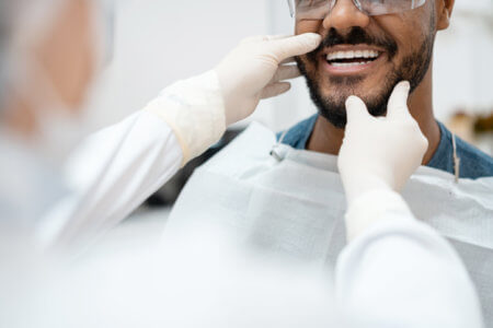 Male patient getting his teeth whitened